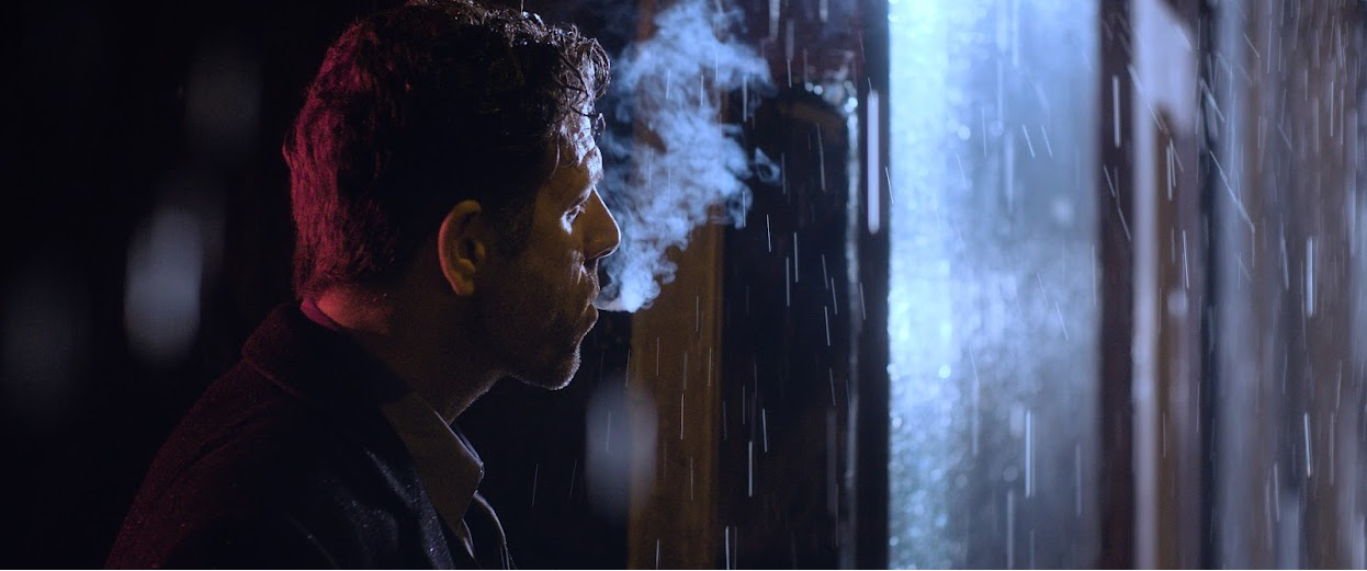 A marketing video of a man smoking.